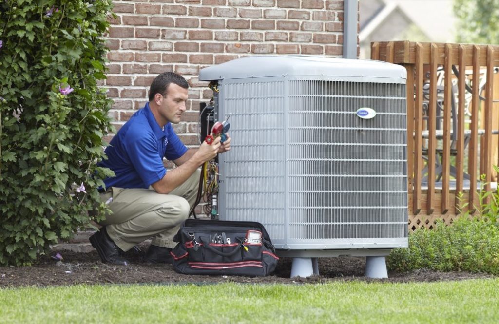 HVAC technician providing springtime AC Maintenance
