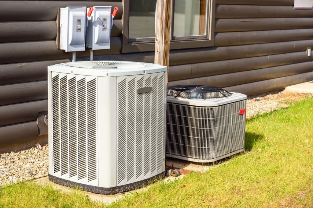 Heating and air conditioning system external units in a backyard